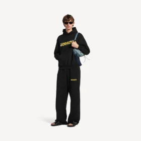 Baggy-joggingbyxor för män i svart med oordnat spraymönster Baggy-joggingbyxor för män i svart med oordnat spraymönster