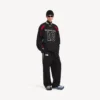 Balenciaga för män | NBA-samarbete, oversized-joggingbyxor i svart/vitt Balenciaga för män | NBA-samarbete, oversized-joggingbyxor i svart/vitt