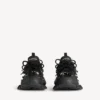 Herr-sneakers i svart med piercingar Herr-sneakers i svart med piercingar