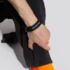 Logotyp-armband med mynt ”Black” 656450-TZ10Z-1268