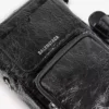 Superbusy vertikal crossbody-väska för män i svart